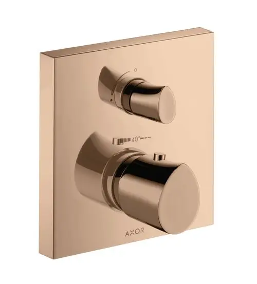 Thermostat mit zwei verchromten Reglern auf quadratischer Platine in Polished Red Gold von AXOR. Anzeige für Temperatureinstellung ist sichtbar.